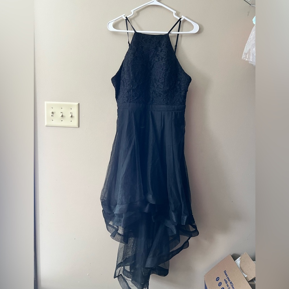 City Triangles halter style high low dress with a sheer tulle waterfall skirt.